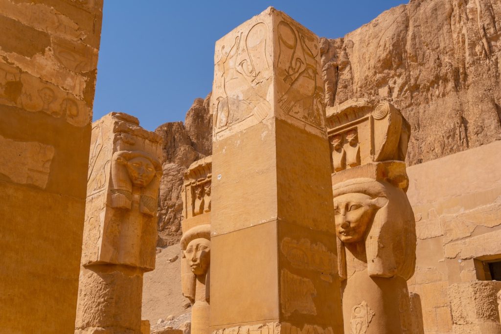 Historical sculptures on the pillars of the Hatshepsut Funerary Temple in Luxor
